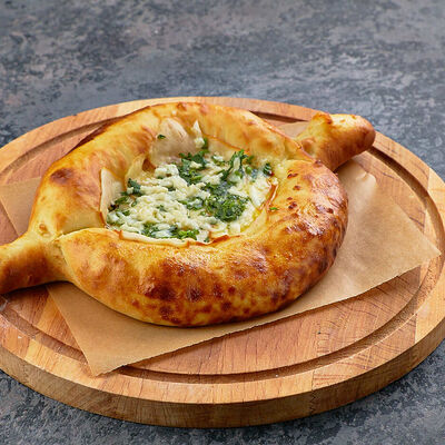 Хачапури по-аджарски четыре сыра в Ели-Пили по цене 550 ₽