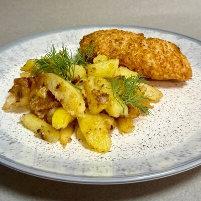 Котлета по-киевски с жареным картофелем и шкварками в Oasis по цене 470 ₽