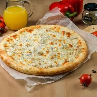 Пицца с жюльеном из цыплёнка в Park cafe по цене 750 ₽
