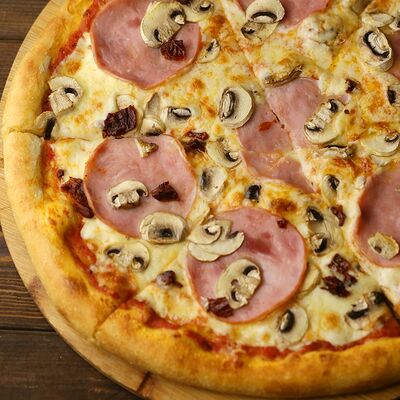 Пицца с ветчиной и грибами в Торшер по цене 790 ₽