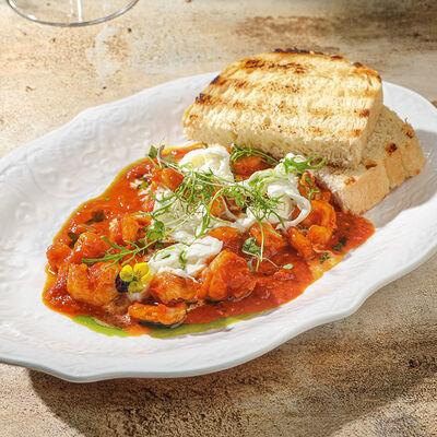 Креветки, томленные в лечо из томатов в Ива по цене 1235 ₽