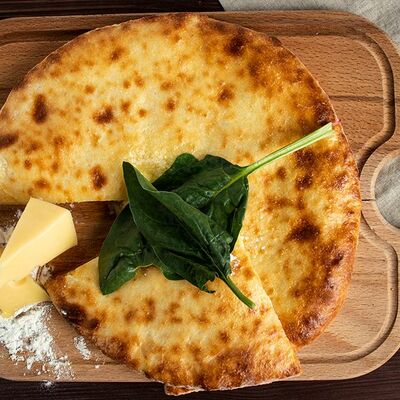 Осетинский пирог со шпинатом в Хинкали у Лали по цене 450 ₽