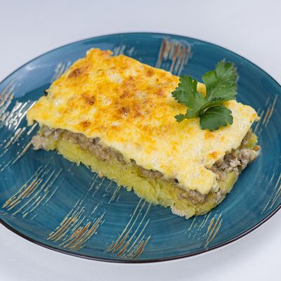 Запеканка картофельная с говядиной в Тарелка по цене 347 ₽