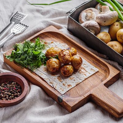 Молодой картофель на мангале в Пельмения по цене 247 ₽