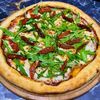 Пицца с руколой и вялеными помидорамив Вкусный по цене 549