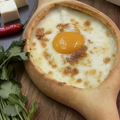 Хачапури по-аджарски в Аджапури по цене 590 ₽