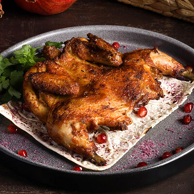 Цыпленок тапака в PRO.Хинкали by Novikov по цене 950 ₽