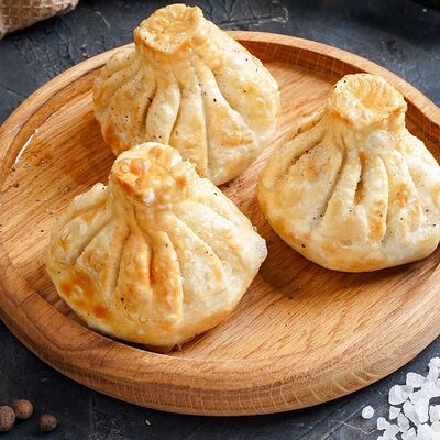 Хинкали жареные с грибами в Чинтамани по цене 510 ₽