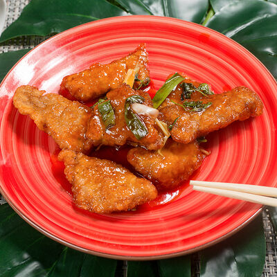 Свинина в кисло-сладком соусе в Кансинь по цене 870 ₽