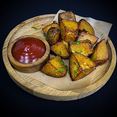 Картофель по-деревенски с сырным соусом в Ostroff по цене 230 ₽