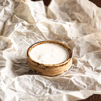 Соус сметанный острый в Хинкали Домашние традиции по цене 70 ₽