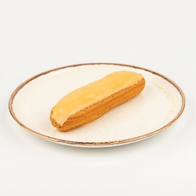 Эклер апельсиновый в Kitchen по цене 290 ₽