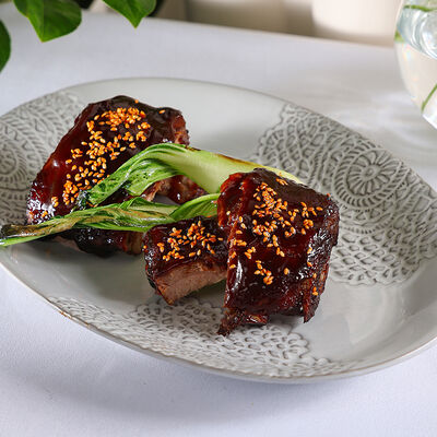 Свиные рёбрышки в солодовой глазури в Юность у моря по цене 1860 ₽