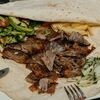 Донер на тарелке с говядиной и картофелем фри в Doner home по цене 540