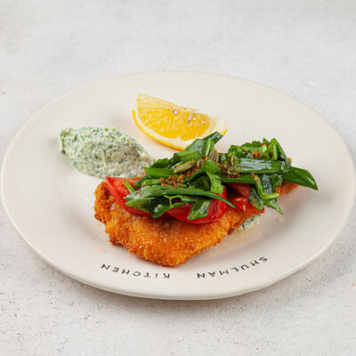 Шницель из дорадо с щавелем, томатами и соусом дзадзики в Shulman Kitchen по цене 950 ₽