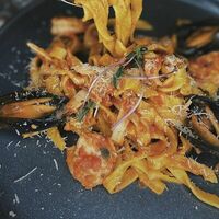 Морковная паста с морепродуктами, в томатном соусе в Гастробар DOM
