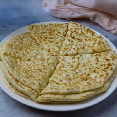 Чапильг - Лепёшка с картофелемв Чайхана Кишлак по цене 420 ₽