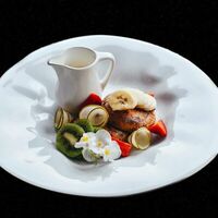 Сырники на топленом молоке с соусом из маракуйи в Лаверна