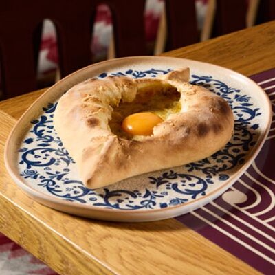 Аджарули четыре сыра в NANA Pirveli по цене 865 ₽