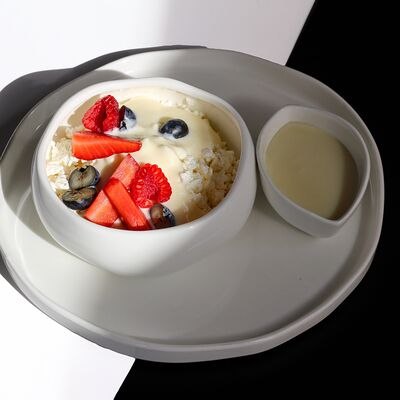 Зернистый творог со сметаной и ягодами в Libido по цене 600 ₽