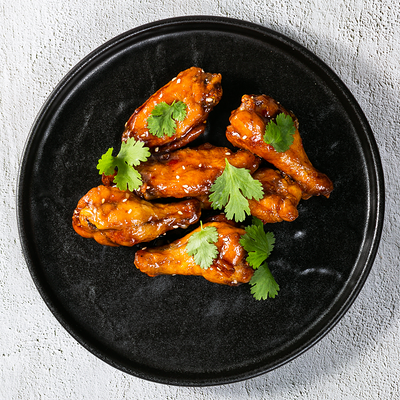 Куриные крылья в азиатской глазури в Гриль-паб ЕрмолаевЪ по цене 565 ₽