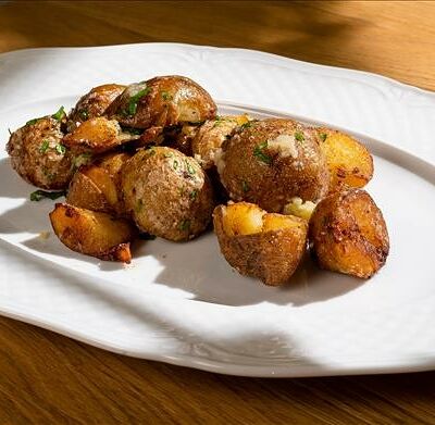 Мини-картофель с пармезаном в Omela по цене 775 ₽