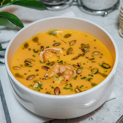 Тыквенный крем-суп с креветками в APOLLO по цене 638 ₽