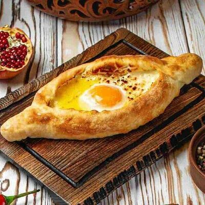 Хачапури по-аджарски в Тут харчо по цене 623 ₽