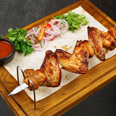 Куриные крылья на мангале в Брынза по цене 290 ₽