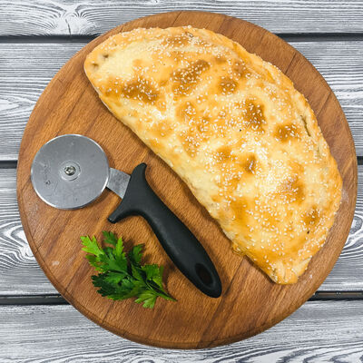 Кальцоне с ветчиной и грибами в Гиро пицца халяль по цене 250 ₽