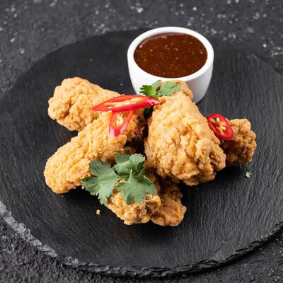 Куриные крылышки в Tokio35 по цене 570 ₽