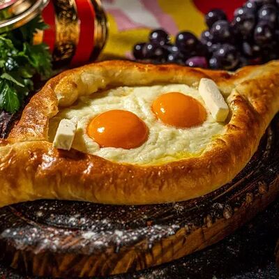 Хачапури по-аджарски с двойным яйцом в Хачапури по цене 570 ₽