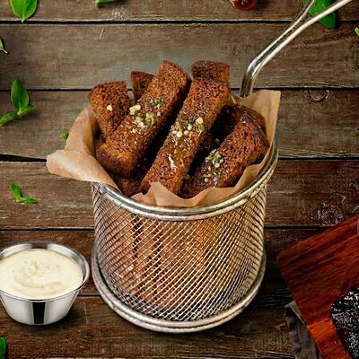 Гренки бородинские с чесноком в Место Про Тесто по цене 285 ₽