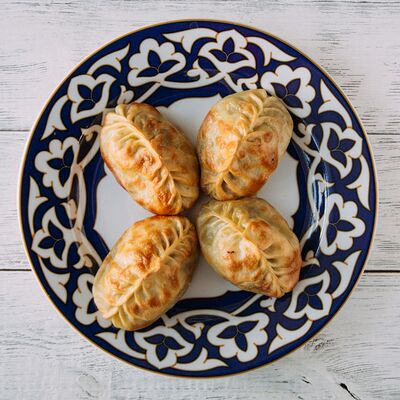 Манты с говядиной жареныев Халиф по цене 420 ₽