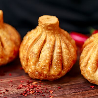 Жареные хинкали с креветками в Хачучачу по цене 735 ₽