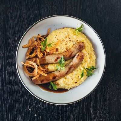 Куриные колбаски с кукурузной кашей в Carne grill по цене 680 ₽