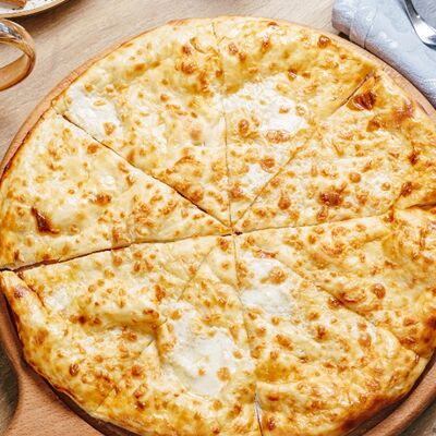 Лепёшка с сыромв СтругановЪ по цене 540 ₽