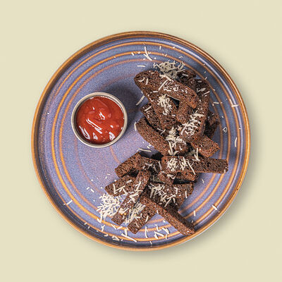 Гренки из бородинского хлеба с пармезаном в Додома по цене 550 ₽