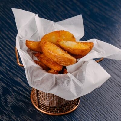 Картофельные дольки в Coffee Pit по цене 190 ₽