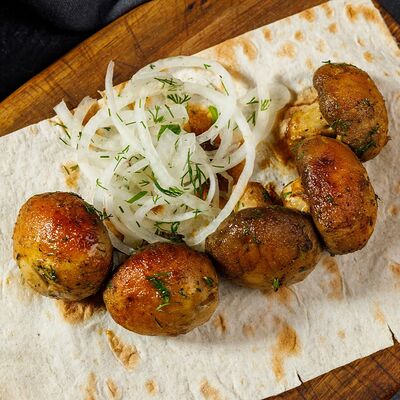 Шампиньоны, запеченные на мангале в Армянская кухня по цене 699 ₽