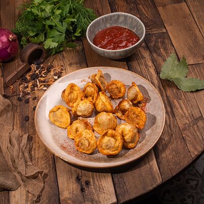 Пельмени жареныев Домашний очаг по цене 410 ₽