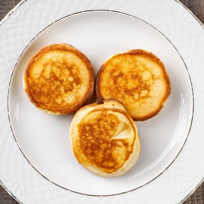 Пшеничный оладушки со сливочным масломв Мамино по цене 220 ₽