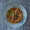 Карри-удон со щечками в Is Ku Sushi Ramen Bar по цене 900