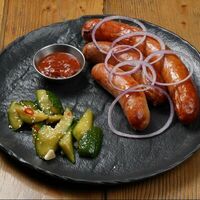 Ассорти колбас с аджикой и битыми огурцами в Brasserie Kriek
