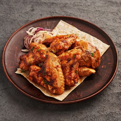 Шашлык из куриных крыльев в Приключения Шурика по цене 479 ₽