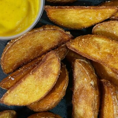 Картофельные дольки со специями по-деревенски в Шаулинь по цене 240 ₽