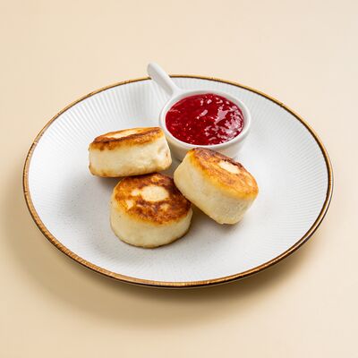 Сырники с малиновым соусом в Север-Метрополь по цене 439 ₽