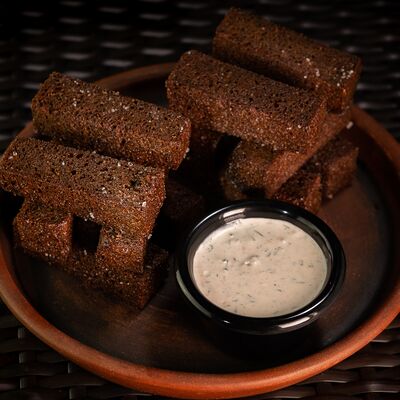 Гренки чесночные в Мама Джоли по цене 410 ₽