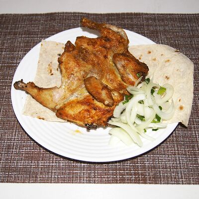 Тушка цыпленка на углях в Шашлыки & Пироги по цене 450 ₽
