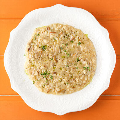 Ризотто с белыми грибами и трюфельным маслом в Сорренто by Novikov по цене 1370 ₽